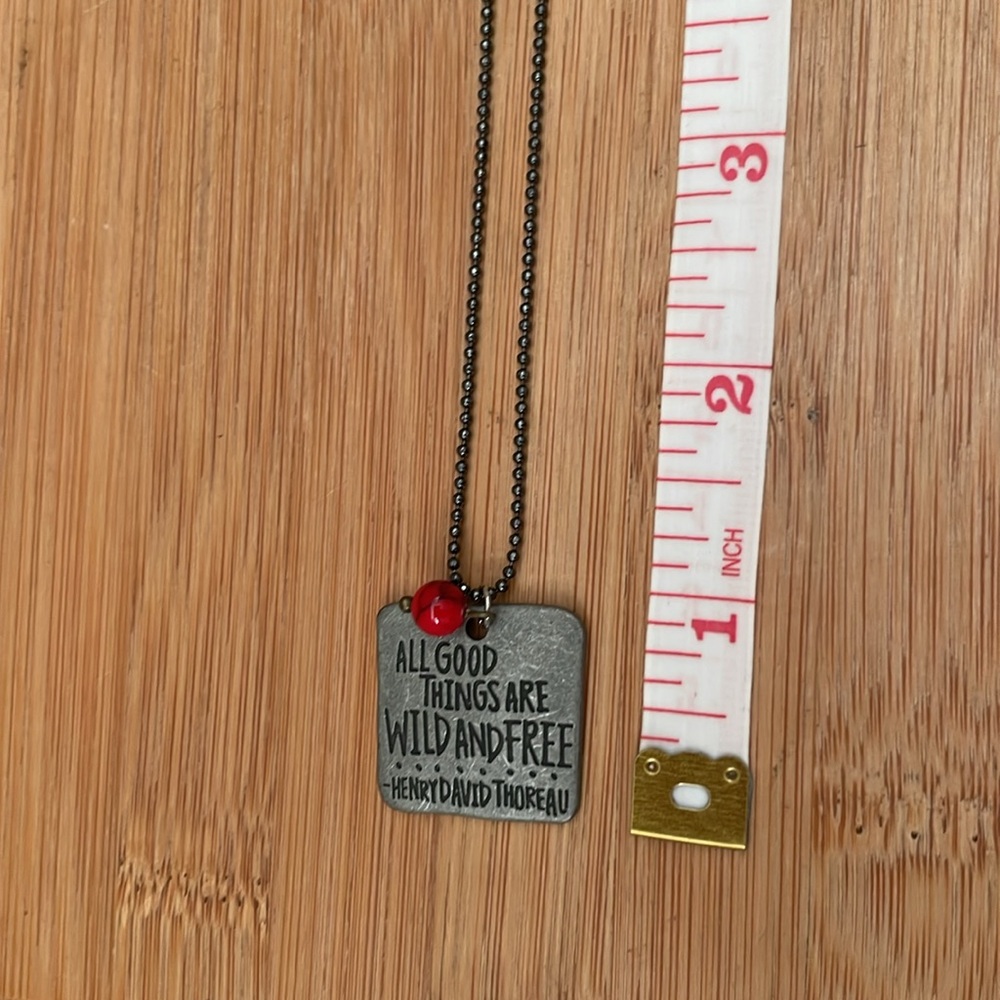 Red and black round gemstone with quote pendant necklace